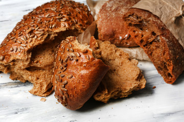 Breaking bread on wooden table