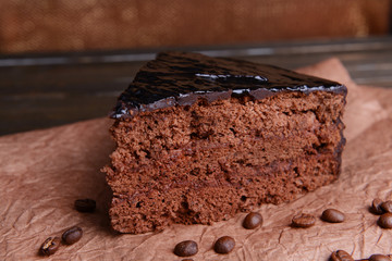 Delicious chocolate cake on table close-up