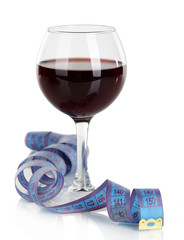 Glass of wine and measuring tape isolated on white