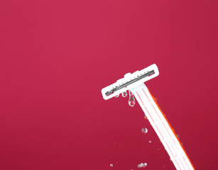 Men shaver on purple background