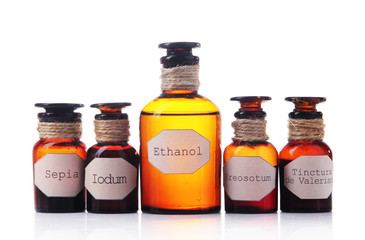 Historic old pharmacy bottles with label  isolated on white