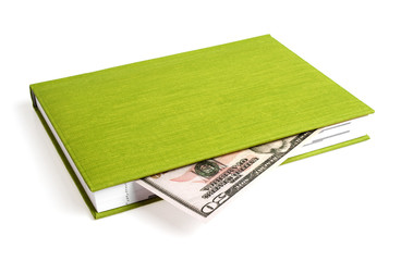 Green book and dollar isolated on a white background