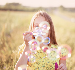 happy girl with soap bubbles