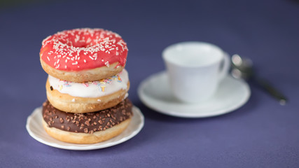 Cup of coffee with donuts