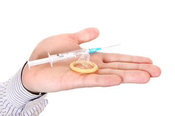Syringe and Condom on a Palm