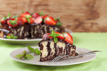 Marble cake with chocolate glaze and strawberries