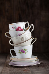 Stack of a variety of flower tea cups.. - 62731973