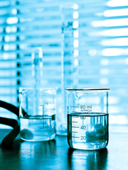 Laboratory glassware with liquid in blue tone