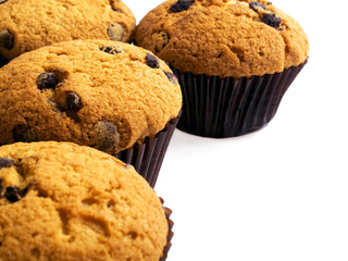 Chocolate chip muffins isolated on white background