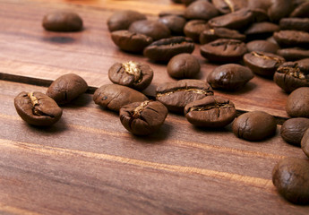 Coffee beans on a wood background