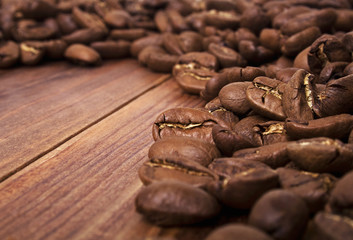 Coffee beans on wood background
