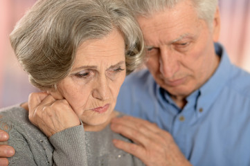 Sad elder couple