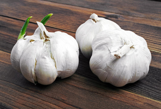 Organic garlic on the wooden background