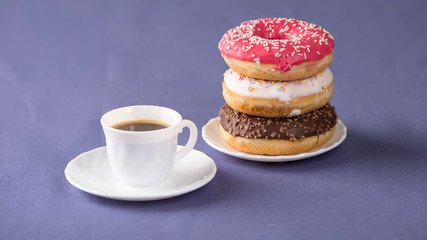 Cup of coffee with donuts