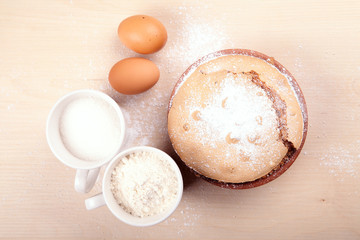 Delicious cake and its ingredients.