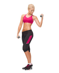 young sporty woman with light dumbbells