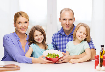 happy family with two kids with salad at home