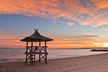Lifeguard hut on the beach at sunset