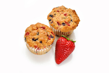 Perfect Berry Muffins with a Fresh Strawberry