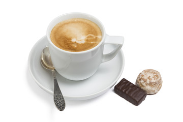 Cup of coffee and sweets on the saucer