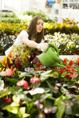 Young woman in flower garden