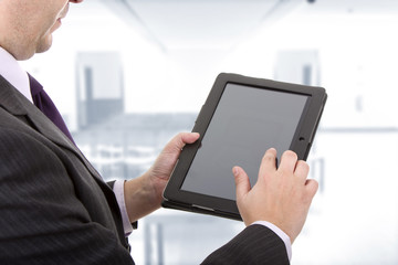 Businessman using touch pad, close up shot