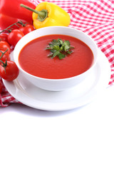 Tasty tomato soup and vegetables, isolated on white