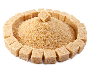 Sugar cube and  a heap of granulated sugar