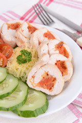 Delicious chicken roll on plate on table close-up