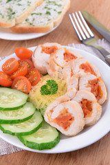 Delicious chicken roll on plate on table close-up