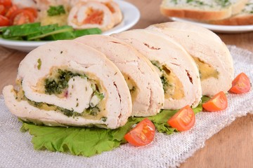 Delicious chicken roll on plate on table close-up