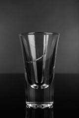 Broken glass on grey background