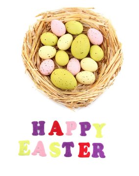 Easter eggs in nest and Happy Easter sign, isolated on white