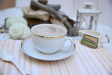 Morning coffee in white, off white, sea debris on the back