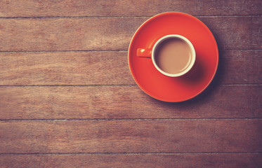 Cup of coffee on a wooden table.