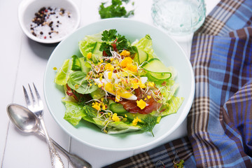 green salad with cucumber, crispy bacon and eggs - obrazy, fototapety, plakaty
