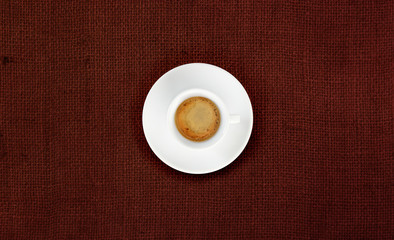 cup of coffee on jute fabric