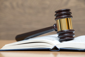 wooden gavel and books