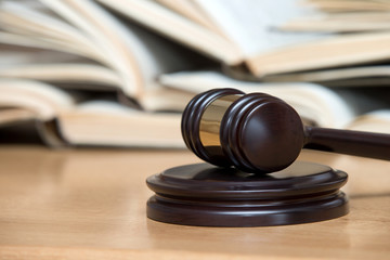 wooden gavel and books