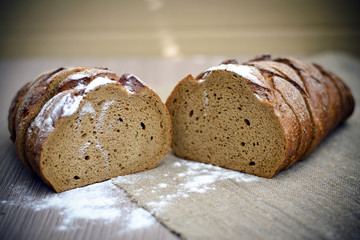 Fresh Tasty Bread on Woody Background