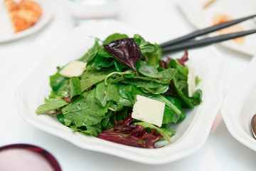 Lettuce with cheese in plate