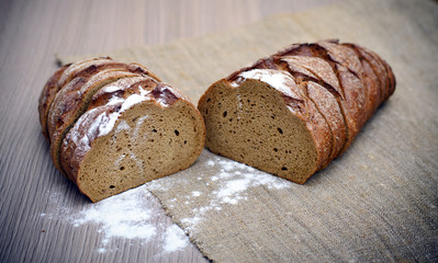 Fresh Tasty Bread on Woody Background
