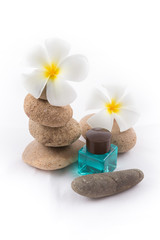 Fototapeta na wymiar isolated of the balance stones with Frangipani flower and shampo