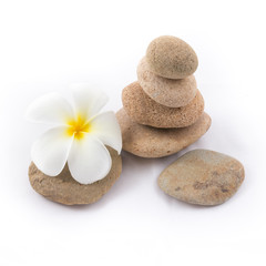 Fototapeta na wymiar isolated of the balance stones with Frangipani flower is zen for