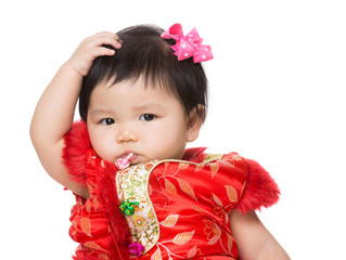 Chinese baby girl scratch her hair