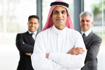 arabian businessman in office with team