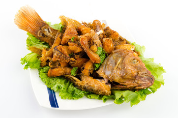Thai food fried fish in white plate isolated on white background