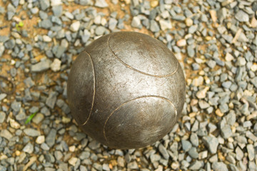 Petanque ball on stone background