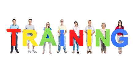 Fototapeta premium Group Of Multi-Ethnic People Holding The Word Training