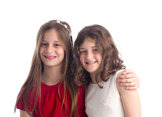 Two Beautiful Sisters hugging isolated on white